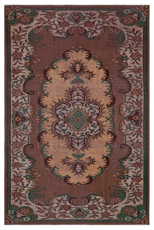 Load image 1 in gallery view. Brown and tan traditional rug with a central floral medallion and ornate botanical border in green and dark brown.