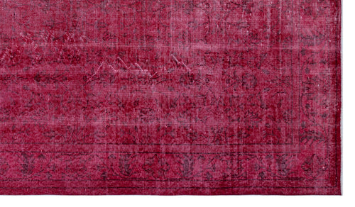 Load image 1 in gallery view. Deep crimson vintage-style rug with a distressed, faded traditional border and central medallion pattern.