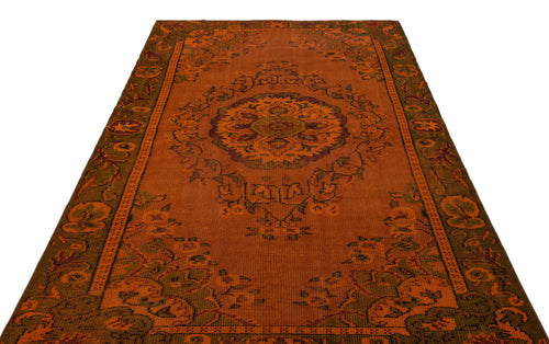 Load image 1 in gallery view. Rust-orange traditional rug with a central floral medallion and dark green border patterns on a white background.