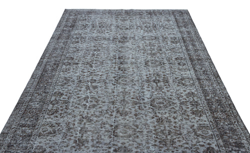 Load image 1 in gallery view. Charcoal and light grey distressed rug with a traditional ornate floral medallion pattern and a wide border.