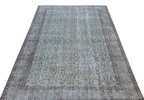 Load image 1 in gallery view. Light blue and brown distressed rug with an intricate floral medallion pattern and a wide decorative border.