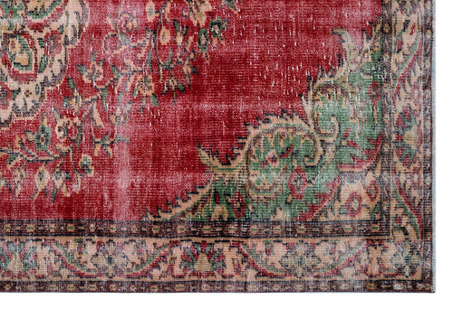 Load image 1 in gallery view. Distressed red rug with green and beige floral medallion patterns and a decorative border.