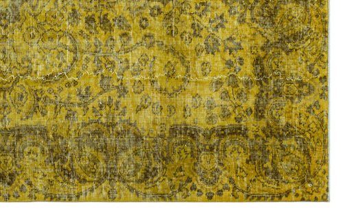 Load image 1 in gallery view. Mustard yellow and olive green distressed rug with an intricate traditional floral medallion pattern.