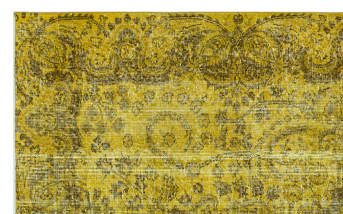 Load image 1 in gallery view. Mustard yellow and olive green vintage-style rug with a distressed traditional floral medallion pattern.