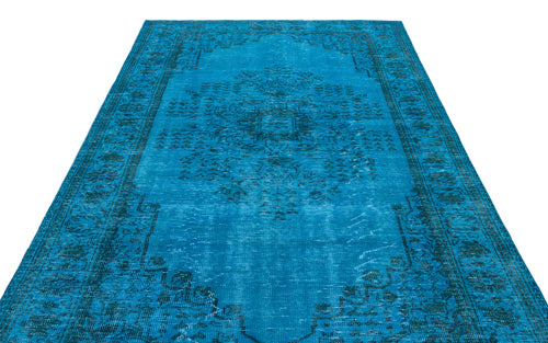Load image 1 in gallery view. Bright blue distressed rug with a dark teal traditional medallion pattern on a white background.