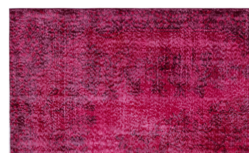 Load image 1 in gallery view. Magenta and black distressed overdyed rug with a faint, traditional floral medallion pattern.