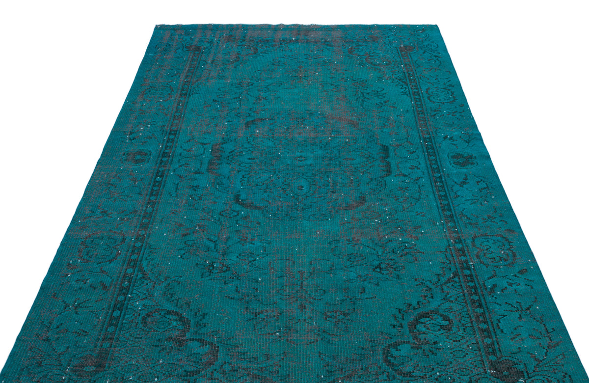 Teal and black distressed traditional area rug with an ornate medallion pattern on a white background.