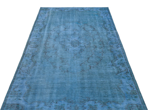 Load image 1 in gallery view. Distressed blue rug with a faded central medallion and ornate border pattern on a white background.