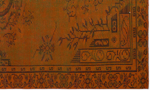 Load image 1 in gallery view. Burnt orange rug with dark brown traditional geometric and floral motifs and a decorative border.