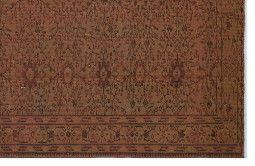 Load image 1 in gallery view. Rust and brown traditional rug with a repeating floral medallion pattern and a geometric border.