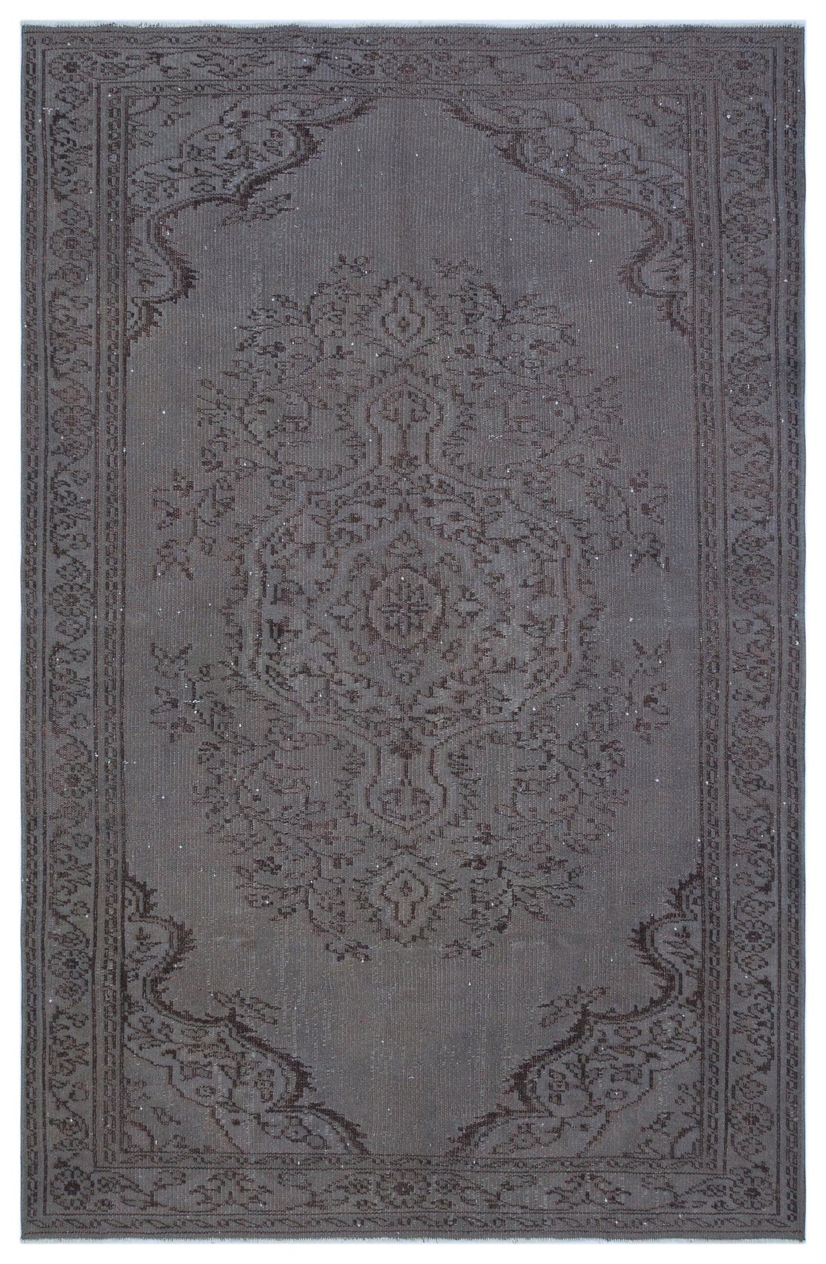Charcoal grey vintage-style rug with a central floral medallion and ornate border pattern.