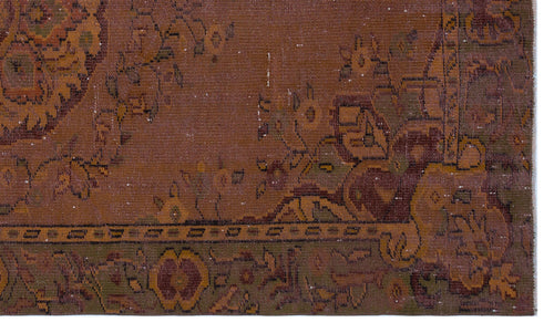 Load image 1 in gallery view. Distressed rust-brown rug with a faded traditional floral medallion pattern and a dark olive green border.