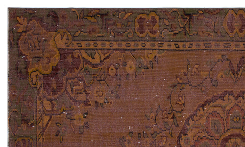 Load image 1 in gallery view. Distressed rust-brown rug with a faded floral medallion pattern and dark olive green border details.