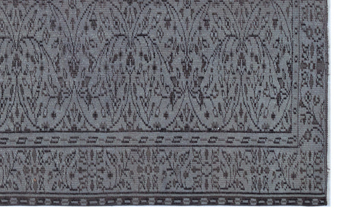 Load image 1 in gallery view. Charcoal and grey rug with a repeating damask-inspired pattern and a geometric border.