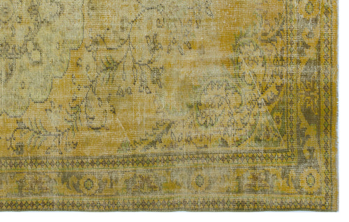 Load image 1 in gallery view. Mustard yellow and olive green vintage-style rug with a distressed floral medallion pattern and geometric border.