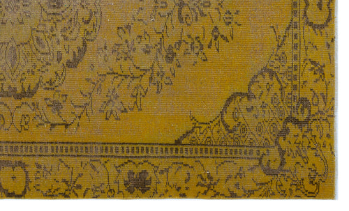 Load image 1 in gallery view. Mustard yellow rug with a distressed dark brown traditional floral medallion pattern and a decorative border.
