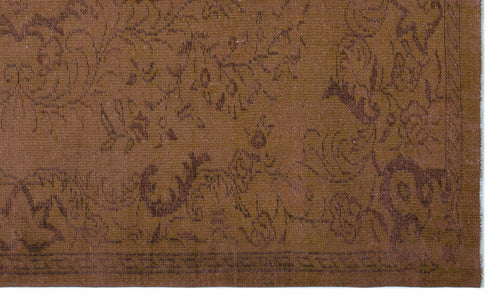 Load image 1 in gallery view. Monochromatic brown rug with a subtle, tone-on-tone floral damask pattern and a geometric border.