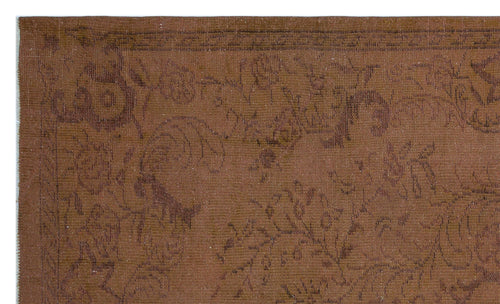 Load image 1 in gallery view. Monochromatic brown rug with a subtle, low-contrast floral pattern and a decorative border.