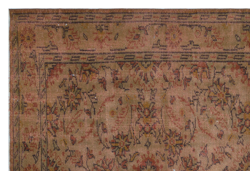 Load image 1 in gallery view. Rust and brown vintage-style rug with a faded floral medallion pattern and a geometric border.