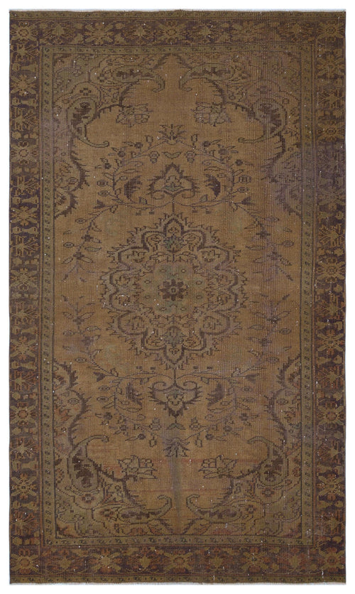Load image 1 in gallery view. Brown vintage-style rug with a central floral medallion, ornate border, and distressed, faded finish.