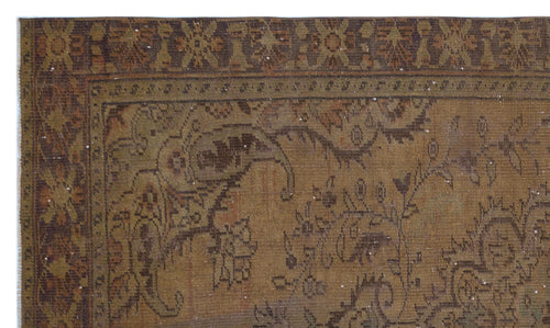 Load image 1 in gallery view. Brown and olive green vintage-style rug with a distressed traditional floral medallion pattern and ornate border.