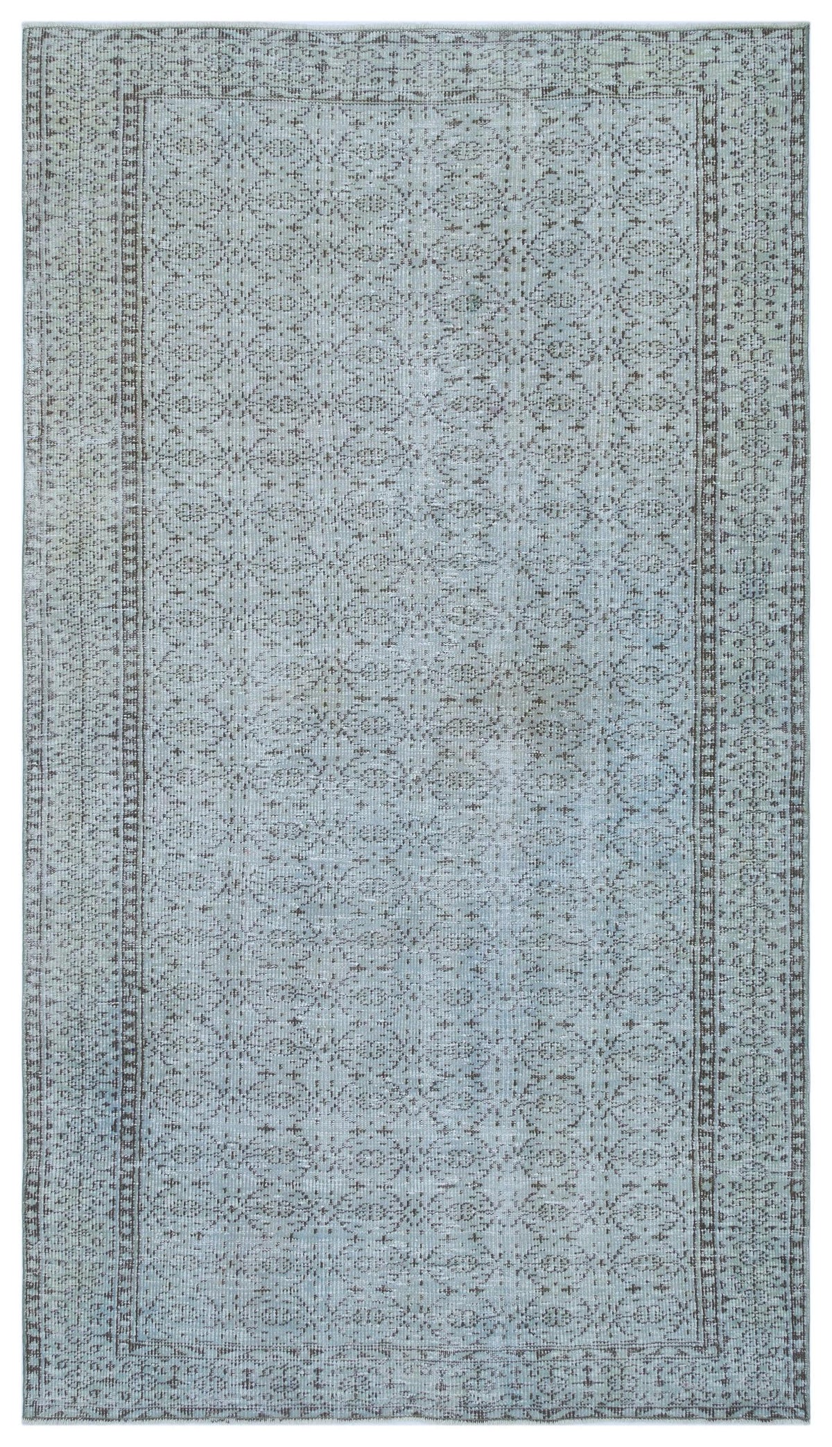 Light blue and grey distressed rug with a repeating geometric lattice pattern and a decorative border.
