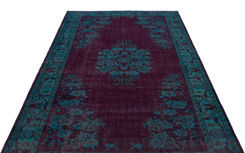 Load image 1 in gallery view. Deep purple rug with a teal floral medallion and border pattern on a white background.