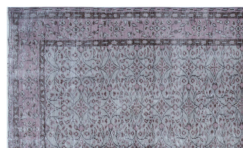 Load image 1 in gallery view. Distressed mauve and grey rug with a traditional floral medallion pattern and a dark border.
