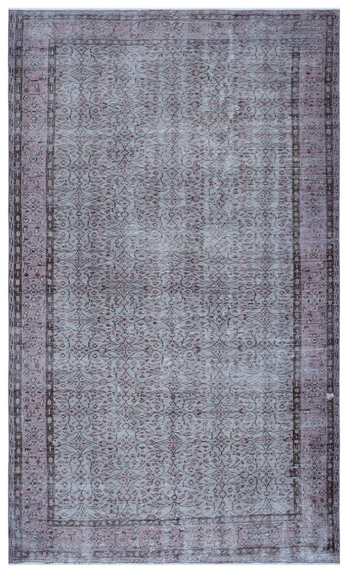 Load image 1 in gallery view. Distressed mauve and grey area rug with a traditional floral vine pattern and a bordered geometric frame.