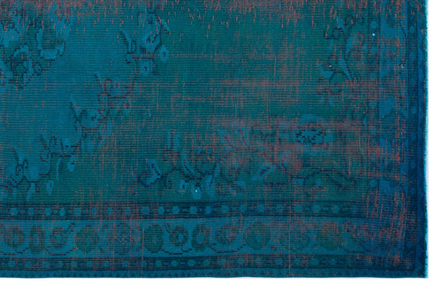 Load image 1 in gallery view. Teal and rust-colored distressed rug with a traditional floral medallion pattern and a geometric border.