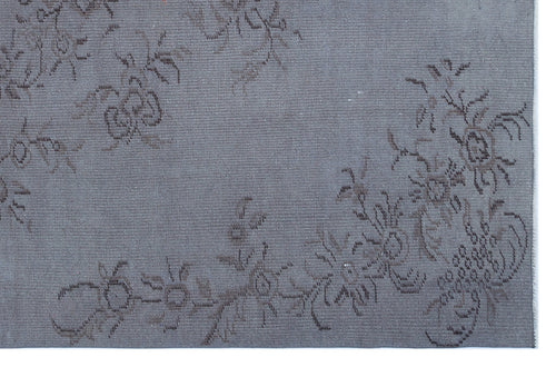 Load image 1 in gallery view. Slate blue rug with a faded, dark grey floral vine pattern.