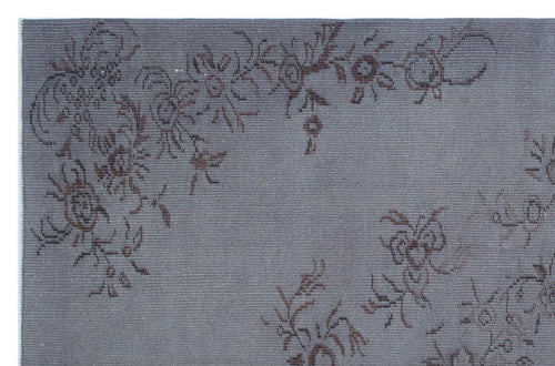 Load image 1 in gallery view. Grey rug with a dark brown floral vine pattern on a textured, woven background.