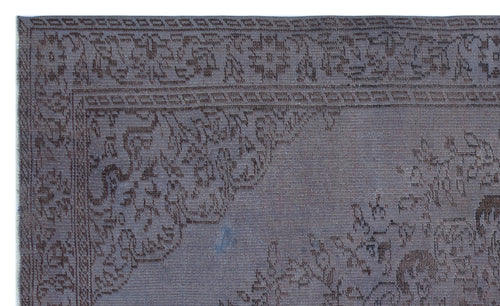 Load image 1 in gallery view. Dark charcoal rug with a tonal, intricate floral medallion pattern and a detailed border.