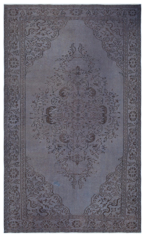 Load image 1 in gallery view. Monochromatic charcoal grey rug with a traditional central floral medallion and ornate border pattern.
