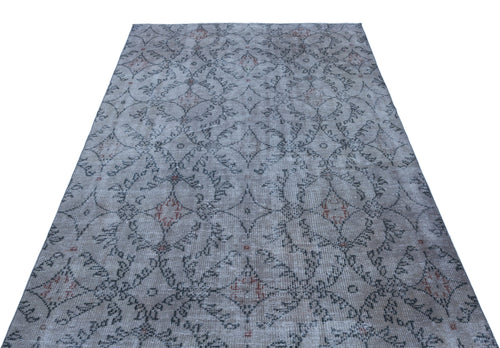 Load image 1 in gallery view. Grey and beige distressed rug with a repeating geometric diamond and floral lattice pattern.