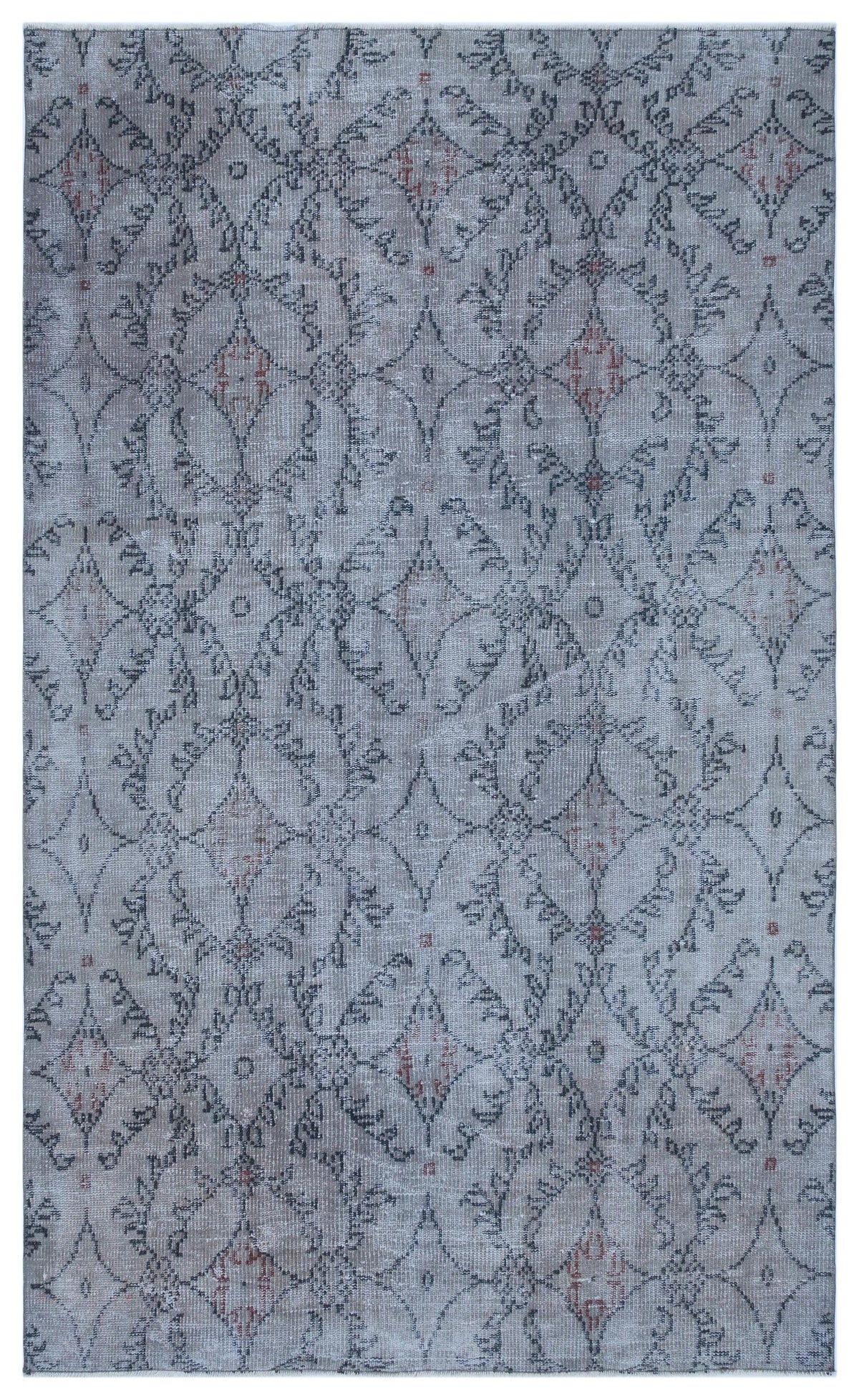 Grey and blue distressed rug with a repeating dark grey floral medallion pattern and small rust-colored accents.