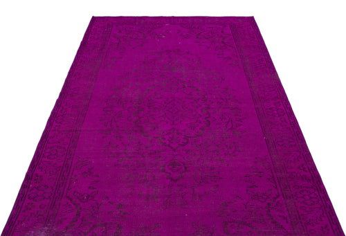 Load image 1 in gallery view. Magenta vintage-style rug with a dark purple traditional floral medallion pattern and a decorative border.