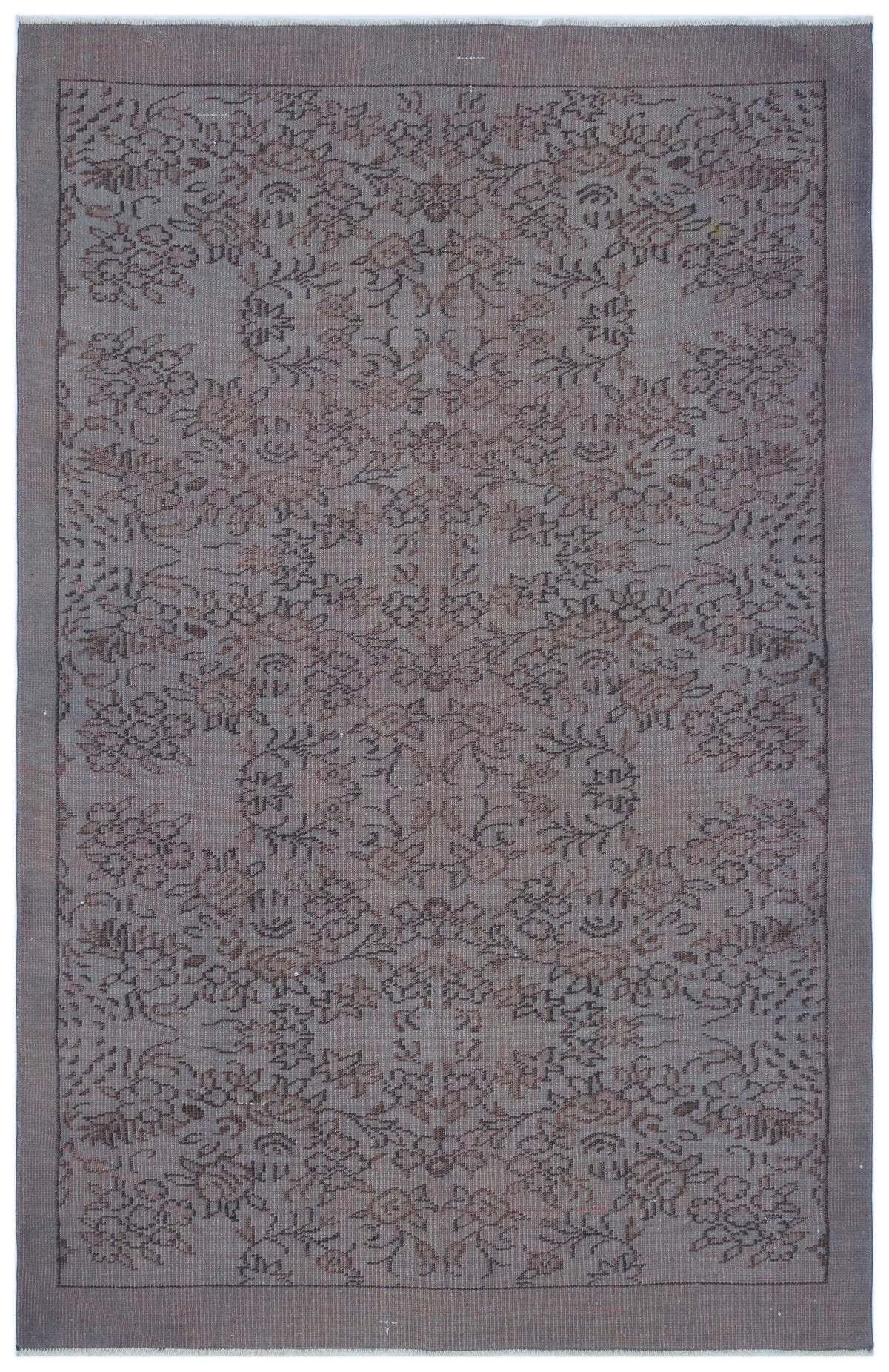 Grey and brown vintage-style rug with a symmetrical floral medallion pattern and a solid border.