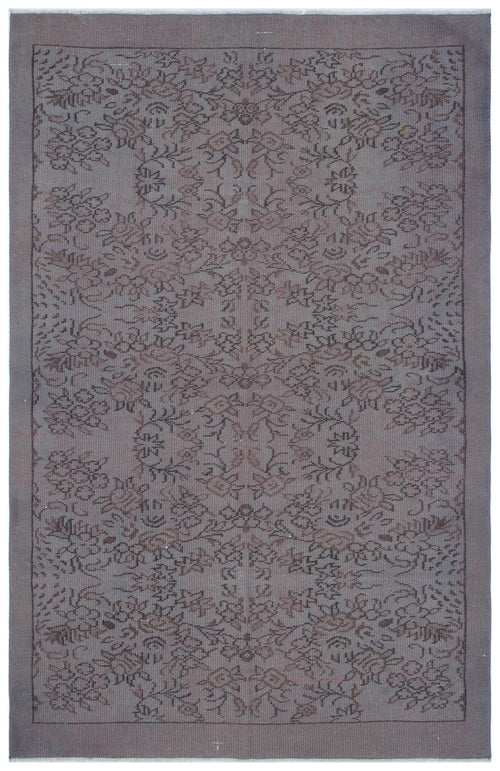 Load image 1 in gallery view. Grey and brown vintage-style rug with a symmetrical floral medallion pattern and a solid border.