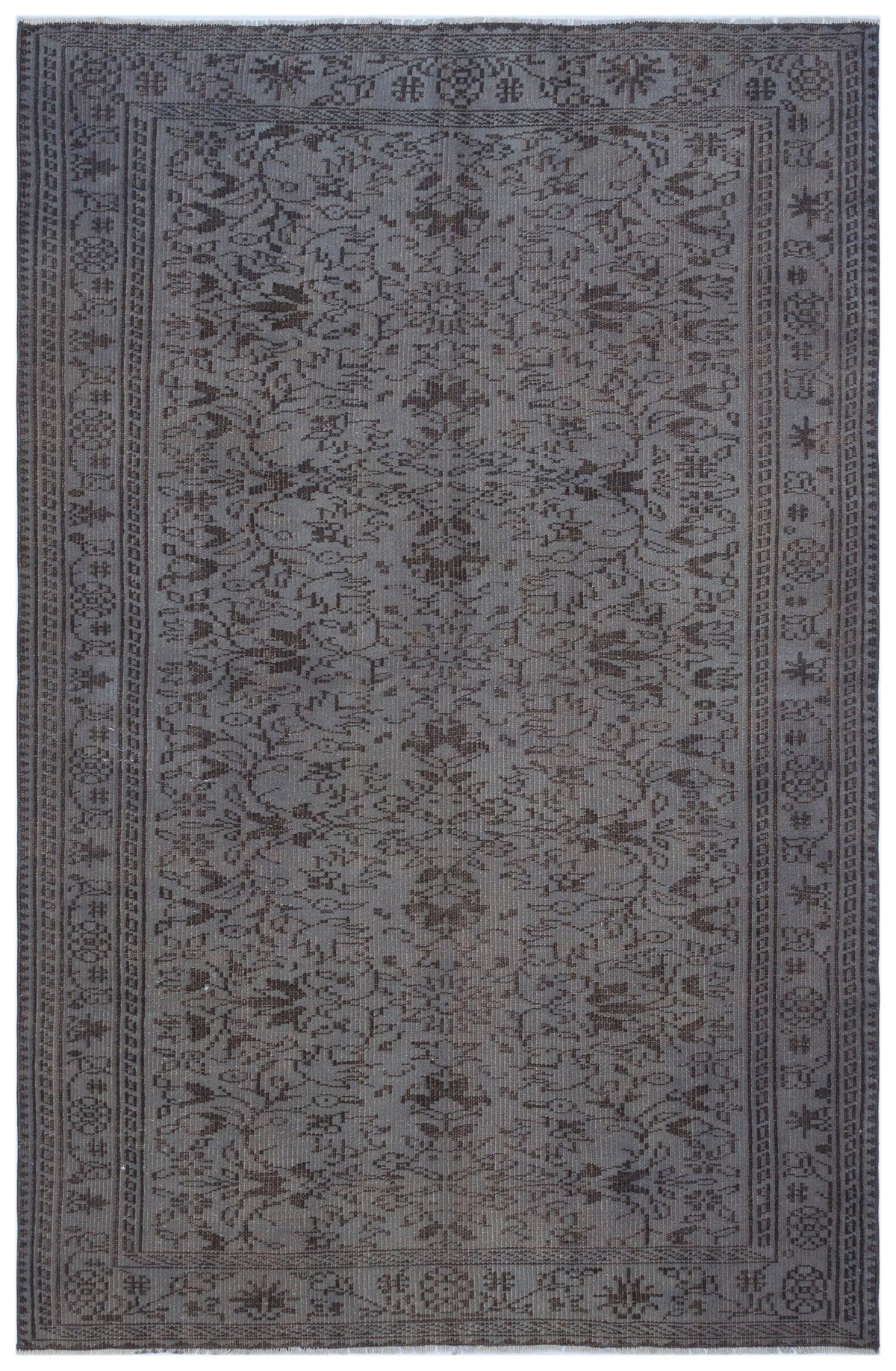 Charcoal grey rug with a distressed traditional floral medallion pattern and a geometric border.