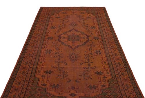 Load image 1 in gallery view. Rust-colored traditional rug with a central medallion and intricate floral border patterns on a white background.