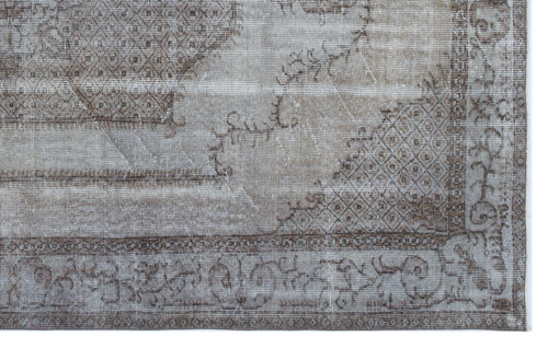 Load image 1 in gallery view. Distressed taupe and brown rug with a faded traditional medallion pattern and intricate geometric border.