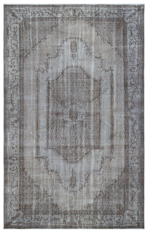 Load image 1 in gallery view. Distressed taupe and grey rug with a central medallion and ornate floral border on a white background.