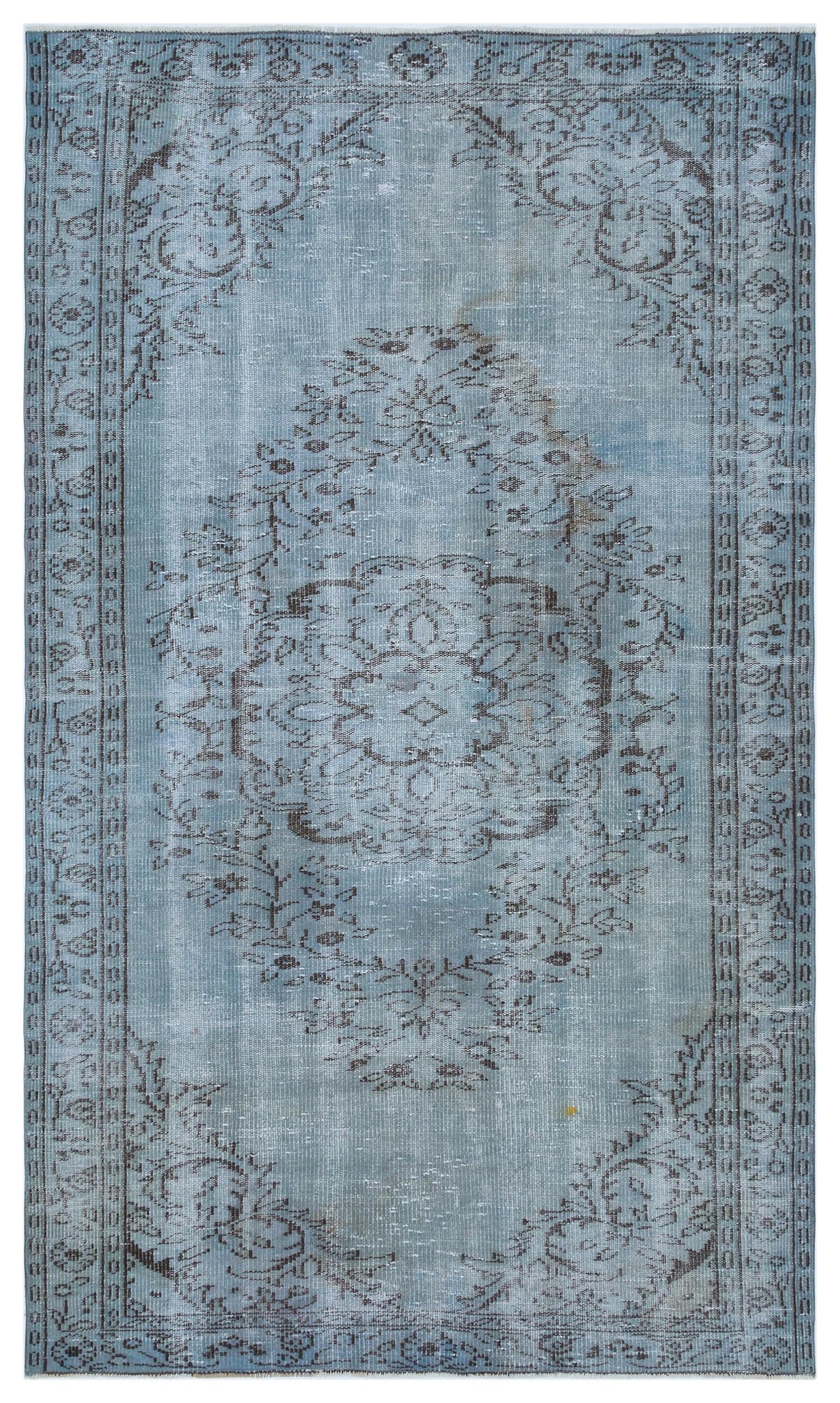 Light blue distressed rug with a dark grey central floral medallion and ornate border pattern on a white background.