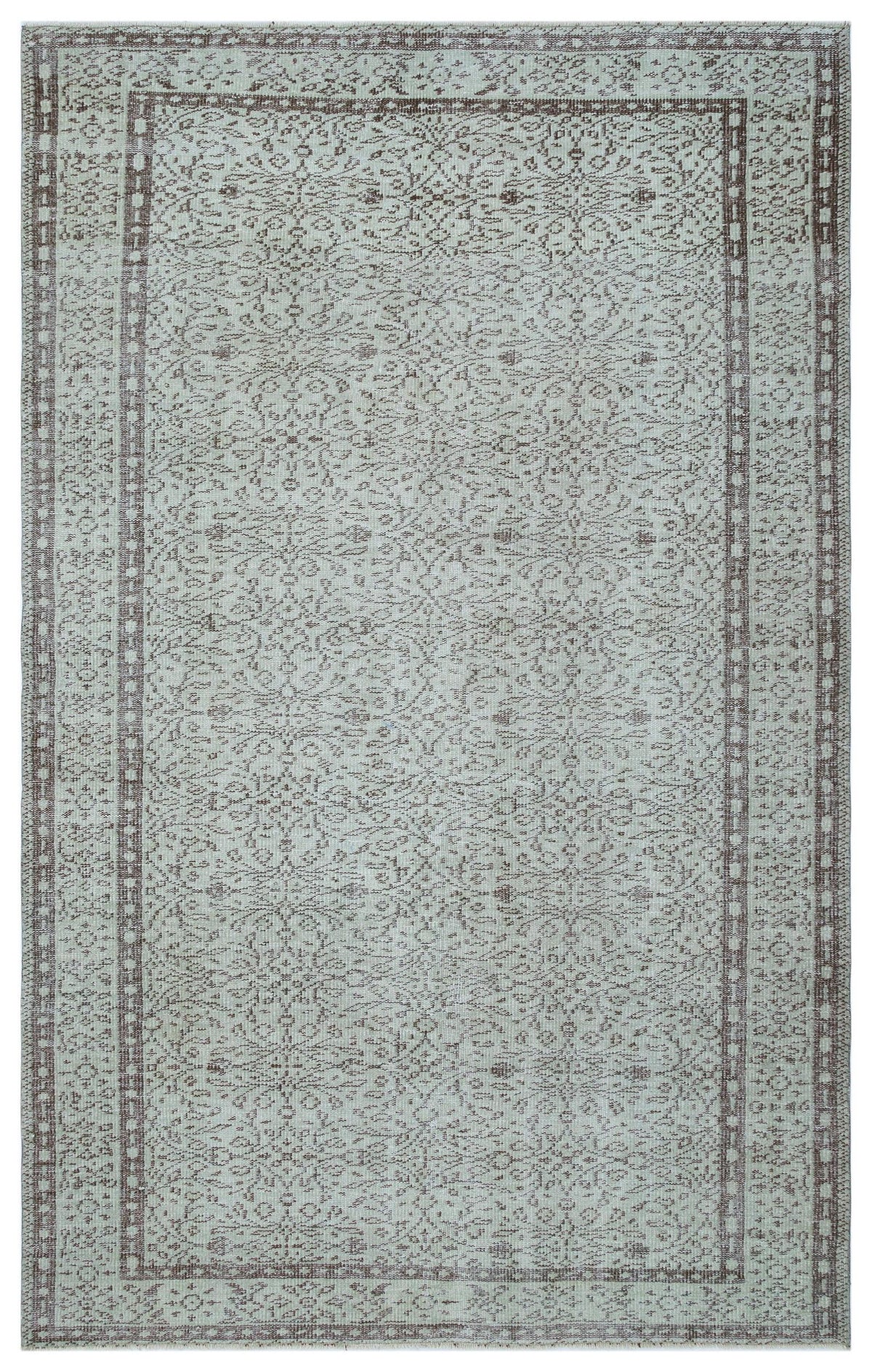 Light blue and brown traditional rug with a distressed floral medallion pattern and a geometric border.