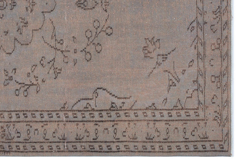 Load image 1 in gallery view. Taupe rug with a dark brown linear floral and geometric border pattern on a white background.