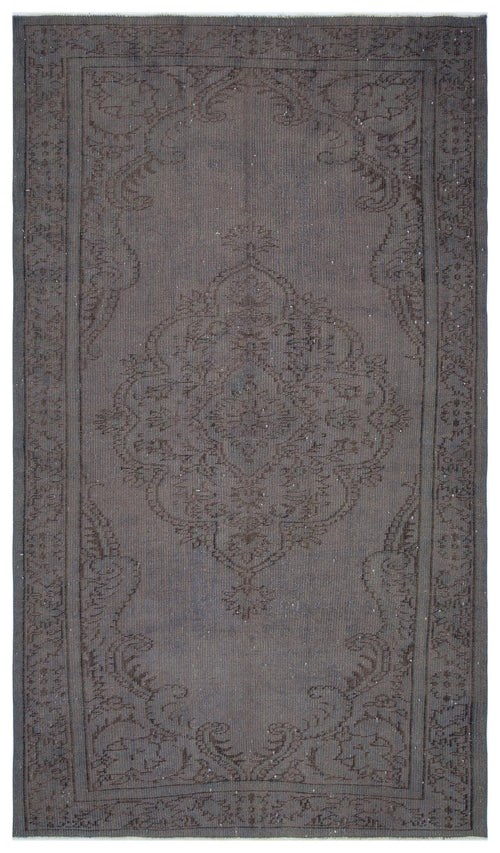 Load image 1 in gallery view. Charcoal grey rug with a tonal, distressed traditional medallion pattern and a decorative border.