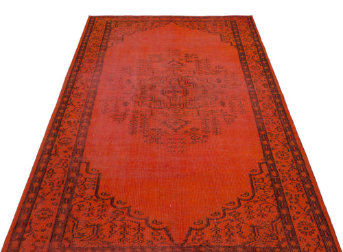 Load image 1 in gallery view. Vibrant orange area rug with a dark brown central medallion and ornate geometric border on a white background.