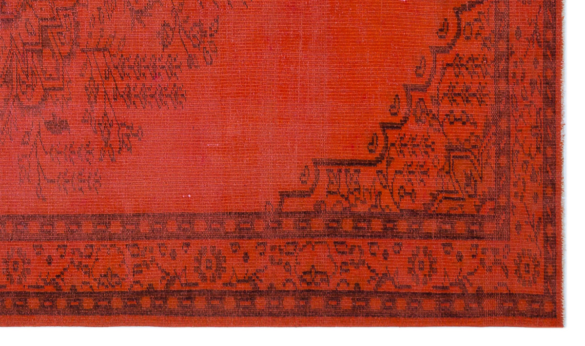 Bright red rug with a dark charcoal traditional floral medallion and geometric border pattern.