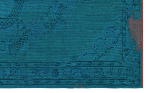 Load image 1 in gallery view. Teal rug with a dark blue traditional border and faint, distressed floral motifs.